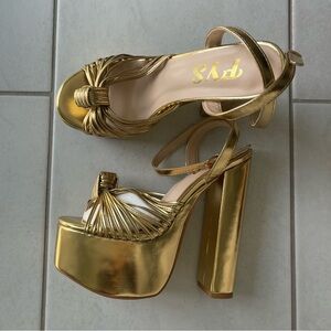 Gold designer inspired platform sandals. SO CUTE but did not fit me after all.